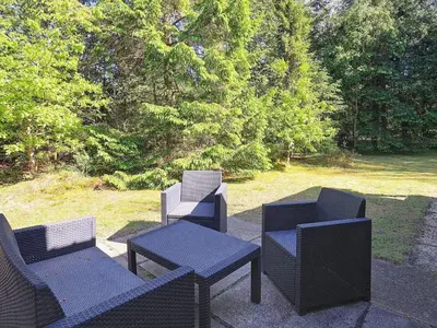 a group of chairs and tables on a patio at 6 person holiday home in Højslev-By Traum in Højslev