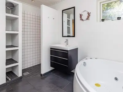 a bathroom with a sink and a bath tub at 6 person holiday home in Højslev-By Traum in Højslev