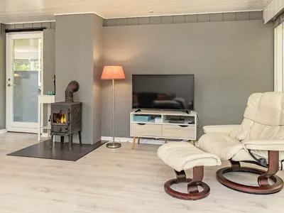 a living room with a fireplace and a television at 6 person holiday home in Højslev-By Traum in Højslev