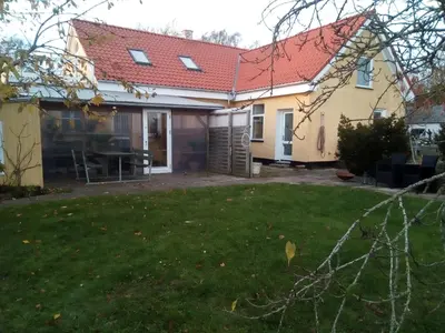 a house with a red roof and a yard at Idyllic country house in Vadum