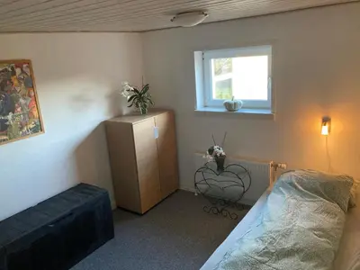 a bedroom with a bed and a window at Idyllic country house in Vadum