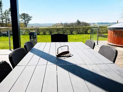 a table with a hat sitting on top of it at 8 person holiday home in Struer-By Traum in Struer