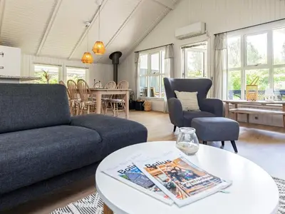 a living room with a couch and a table at 8 person holiday home in Højslev-By Traum in Højslev