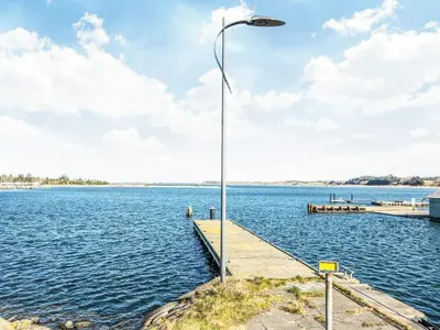 a street light on a dock on a body of water at 8 person holiday home in Højslev-By Traum in Højslev