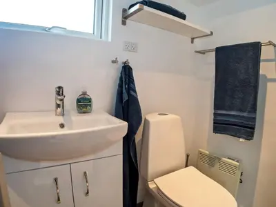a bathroom with a sink and a toilet at 6 person holiday home in Thyholm-By Traum in Thyholm