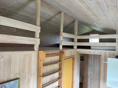 an inside view of a wooden house with a ceiling at Ældre Sommerhus Max 4 voksne og 4 børn in Lemvig