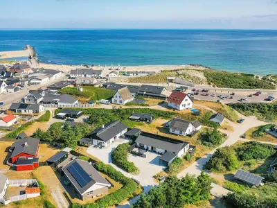 an aerial view of a village next to the ocean at Renovated Retreat with Pool - By Traum Ferienwohnungen in Thisted