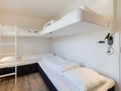 a small room with two bunk beds in it at Renovated Retreat with Pool - By Traum Ferienwohnungen in Thisted