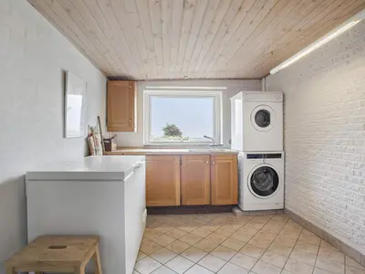 a kitchen with a washing machine and a window at 8 person holiday home in Vesløs-By Traum in Vesløs