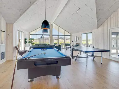 a pool table in a room with two ping pong tables at Luxury Retreat by Limfjorden - By Traum Ferienwohnungen in Spottrup