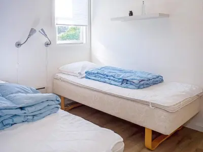 a room with two beds and a window at 6 person holiday home in Vestervig-By Traum in Vestervig