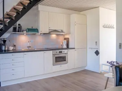 a kitchen with white cabinets and a refrigerator at 6 person holiday home in Vestervig-By Traum in Vestervig