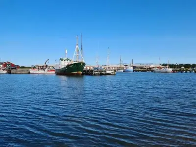 a large boat is docked in a body of water at 6 person holiday home in Vestervig-By Traum in Vestervig
