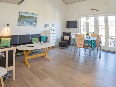 a living room with a couch and a table at 6 person holiday home in Vestervig-By Traum in Vestervig