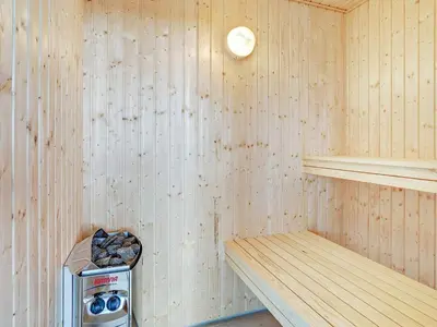 a inside of a sauna with a stove at Luxury Retreat for 18 - By Traum Ferienwohnungen in Spottrup