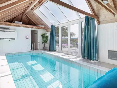 a pool in a house with a glass ceiling at 10 person holiday home in Fjerritslev-By Traum in Fjerritslev