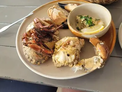 a plate of food with seafood on a table at 6 person holiday home in Vestervig-By Traum in Vestervig