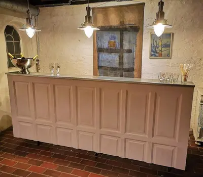 a bar in a room with a brick wall at Glædegården -Glaede Landhof- 12 beds! in Frøstrup