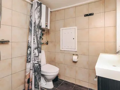 a bathroom with a toilet and a sink at 4 person holiday home in Farsø-By Traum in Farsø