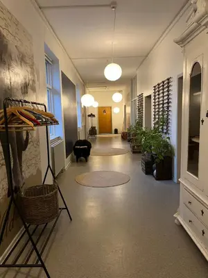 a hallway of an office with a room with plants at Room 3 - Hawkraft kulturhotel in Vestervig
