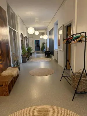 a hallway with rugs on the floor of a building at Room 3 - Hawkraft kulturhotel in Vestervig