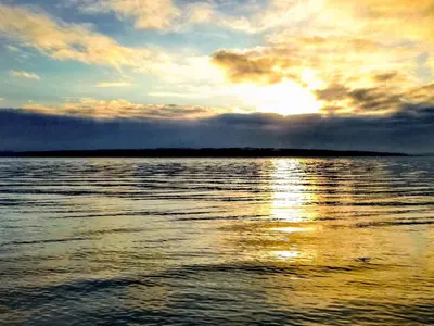 a sunset over a large body of water at 7 person holiday home in Lemvig-By Traum in Lemvig
