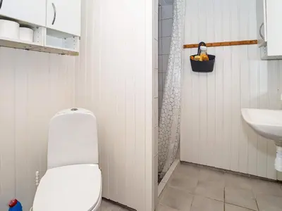 a bathroom with a toilet and a sink at 4 person holiday home in Thisted-By Traum in Thisted