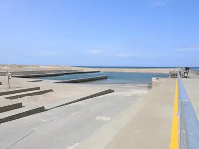 a walkway leading down to the beach with water at 4 person holiday home in Thisted-By Traum in Thisted