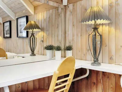 a room with a desk with two lamps and a chair at 8 person holiday home in Fjerritslev-By Traum in Fjerritslev