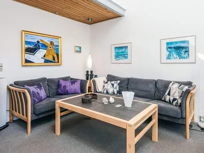 a living room with a couch and a coffee table at 6 person holiday home in Vestervig-By Traum in Vestervig