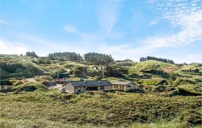 a village on the side of a hill at Nice Home In Løkken With Sauna in Løkken