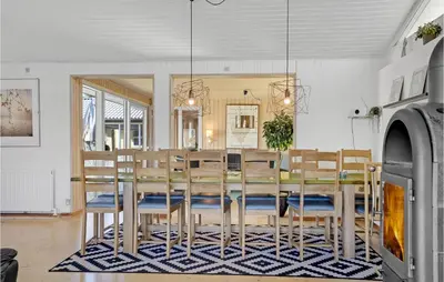 a dining room with a table and chairs at Gorgeous Home In Blokhus With Sauna in Blokhus