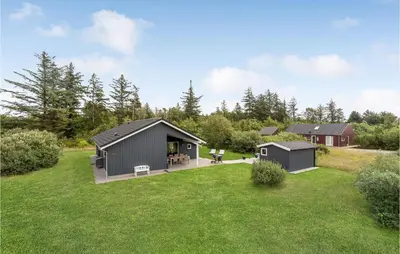 a large yard with a shed and a house at Amazing Home In Brovst With Kitchen in Brovst