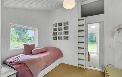 a bedroom with a bed with a pink blanket at Stunning Home In Thisted With Wifi in Thisted