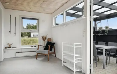 a living room with a table and a window at Nice Home In Thisted With Kitchen in Thisted