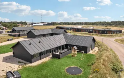 an aerial view of a house with a playground at Lovely Home In Thisted With Sauna in Thisted