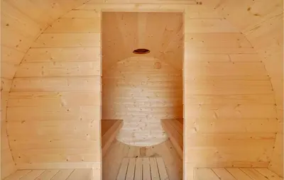 a sauna in a wooden cabin with a bench at Lovely Home In Thisted With Sauna in Thisted
