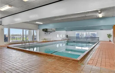 a large swimming pool in a building at Amazing Home In Vestervig With Sauna in Vestervig