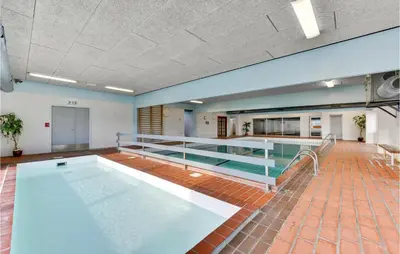 a large swimming pool in a large room at Amazing Home In Vestervig With Sauna in Vestervig
