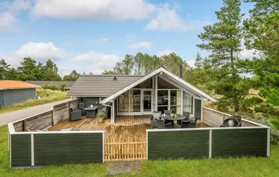 a small house with a deck and a patio at Beautiful Home In Thisted With Kitchen in Thisted