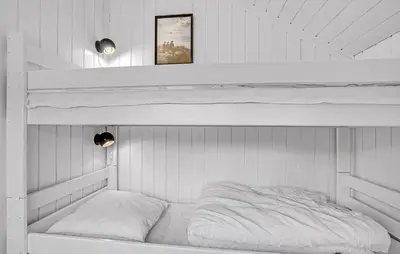 a white room with two bunk beds in it at Beautiful Home In Thisted With Kitchen in Thisted