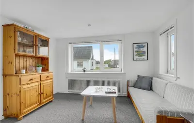 a living room with a couch and a table at Lovely Home In Thisted With Kitchen in Thisted