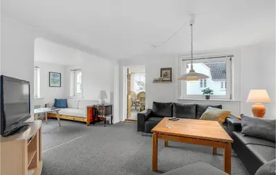 a living room with a couch and a tv at Lovely Home In Thisted With Kitchen in Thisted
