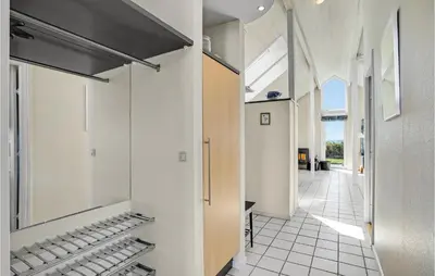 a hallway of a kitchen with white walls and ceilings at Stunning Home In Struer With Wifi in Struer