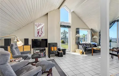 a living room with couches and a fireplace at Stunning Home In Struer With Wifi in Struer