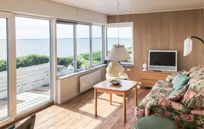 a living room with a view of the ocean at Lovely Home In Spøttrup With Wifi in Spottrup