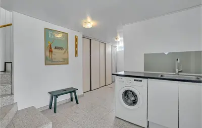 a kitchen with a washing machine and a sink at Lovely Home In Spøttrup With Wifi in Spottrup