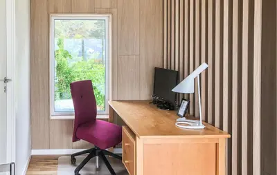a room with a desk with a computer and a chair at Lovely Home In Spøttrup With Wifi in Spottrup