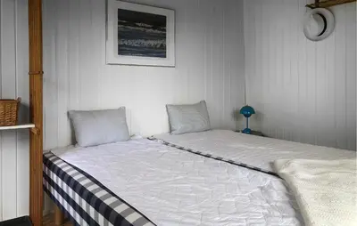 a small bedroom with a bed in a room at Lovely Home In Spøttrup With Wifi in Spottrup
