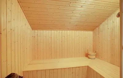 a wooden sauna with a bucket in it at Beautiful Home In Thyholm With Wifi in Thyholm